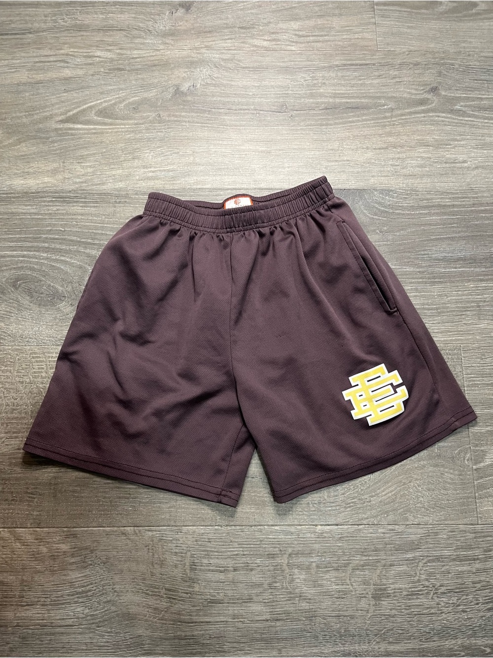 Eric Emanuel Maroon Shorts with Yellow & White Logo